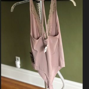 Pale pink body suit